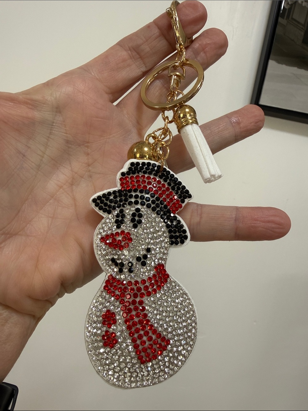 nOir Jewelry Festive Snowman Keychain with Red and Black Accents
